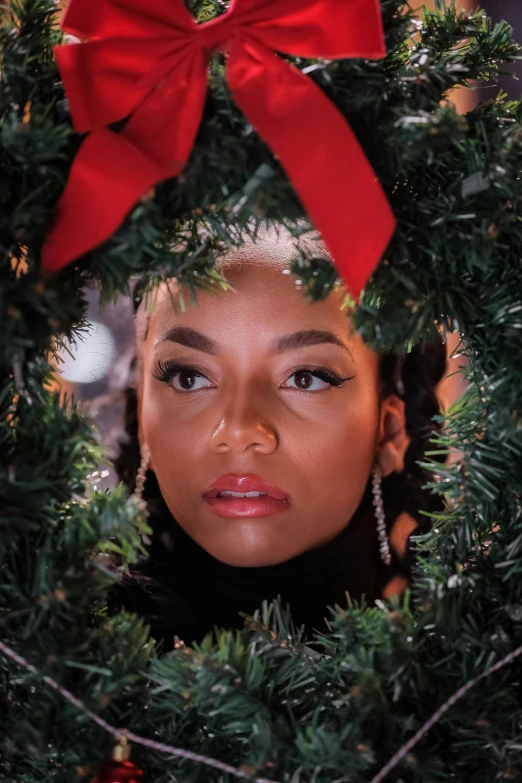 a young woman with a wreath as headband for the camera