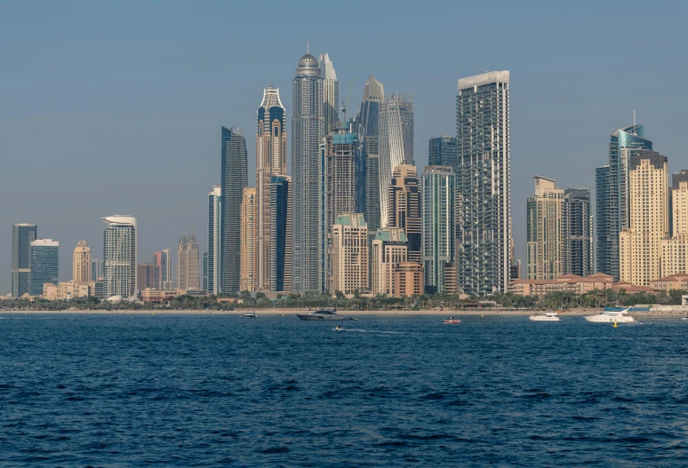 a boat is traveling by the water near the city