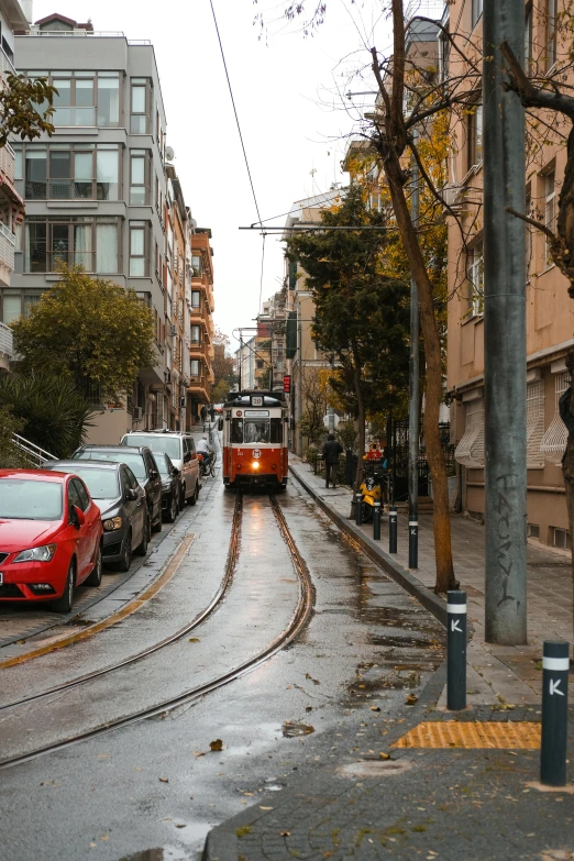 city street with a trolley in the middle