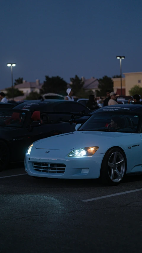 a car in a lot filled with lots of parked cars