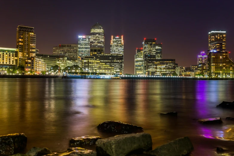 a beautiful city skyline is lit up with a lot of bright lights