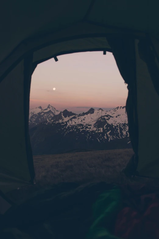 the view of mountains through a tent window