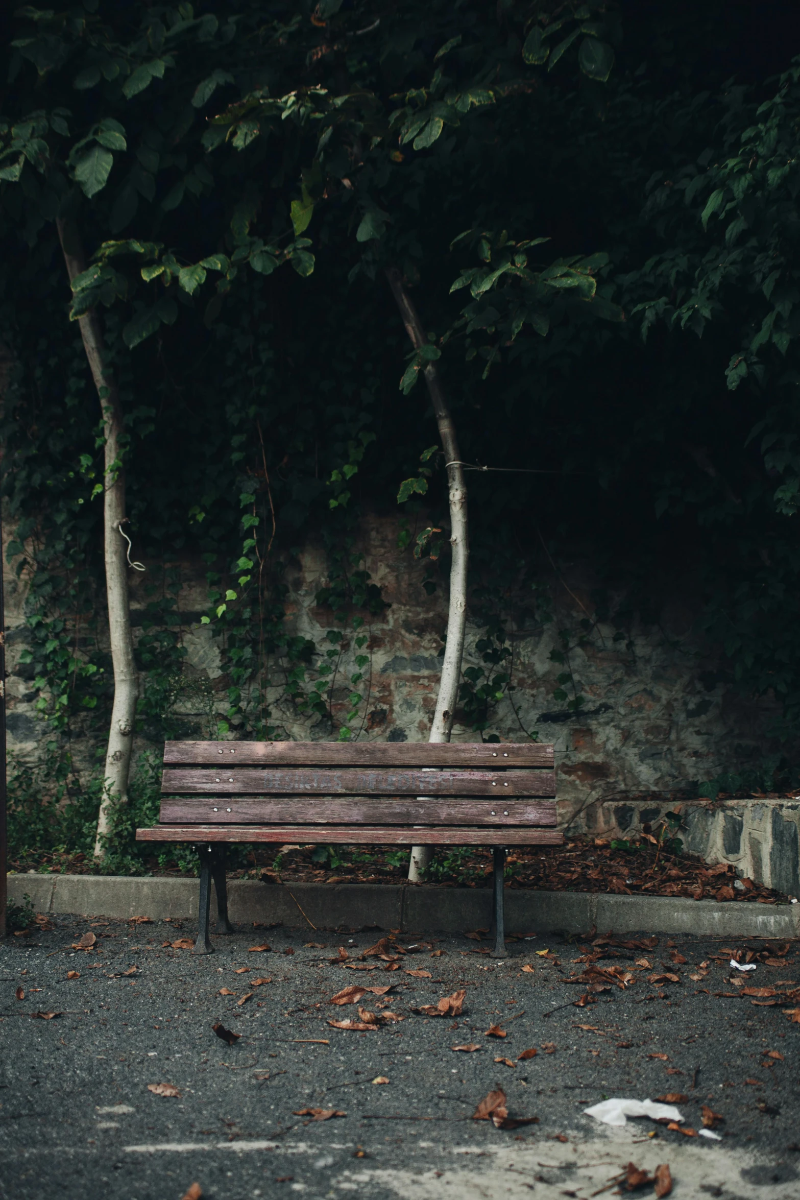 a park bench in a deserted parking lot