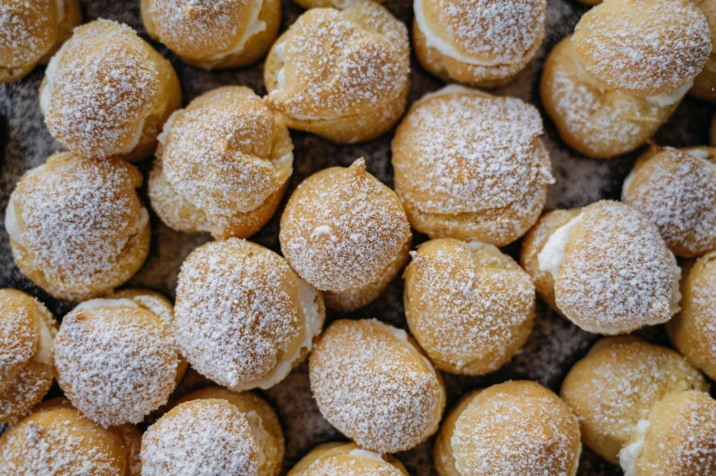 powdered sugar puffs in a pile