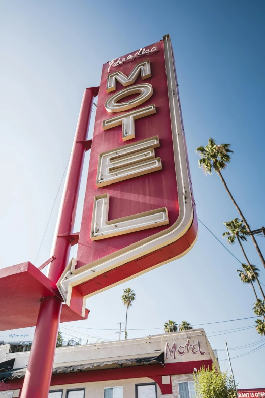 a large red neon sign with a word on it