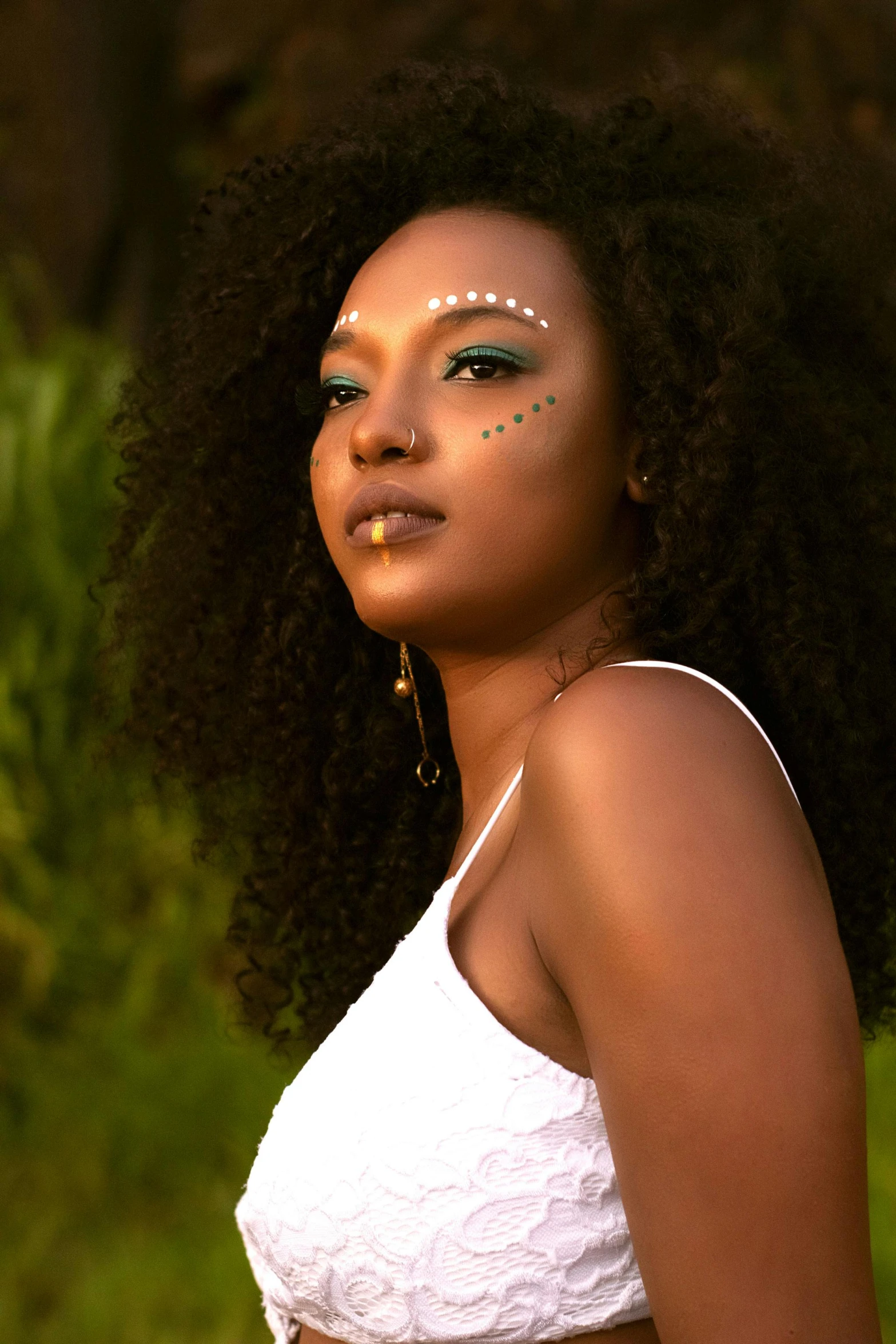 a beautiful young lady with a piece of face paint