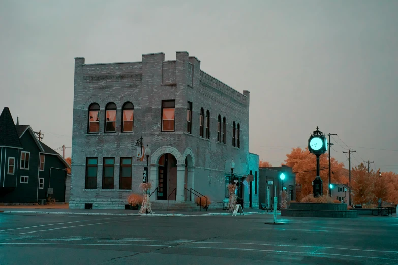 a building at an intersection on a dark evening