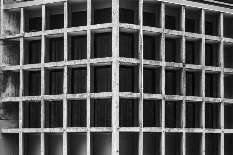 the side of a building being constructed in black and white