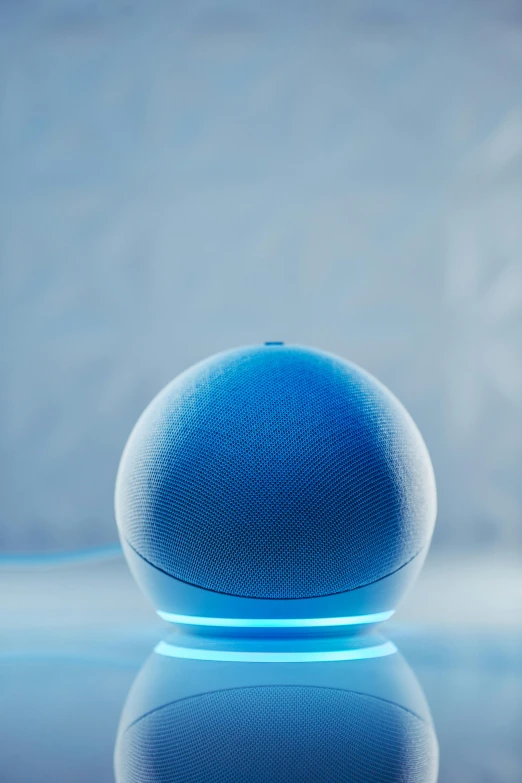 the blue object is reflected in the surface