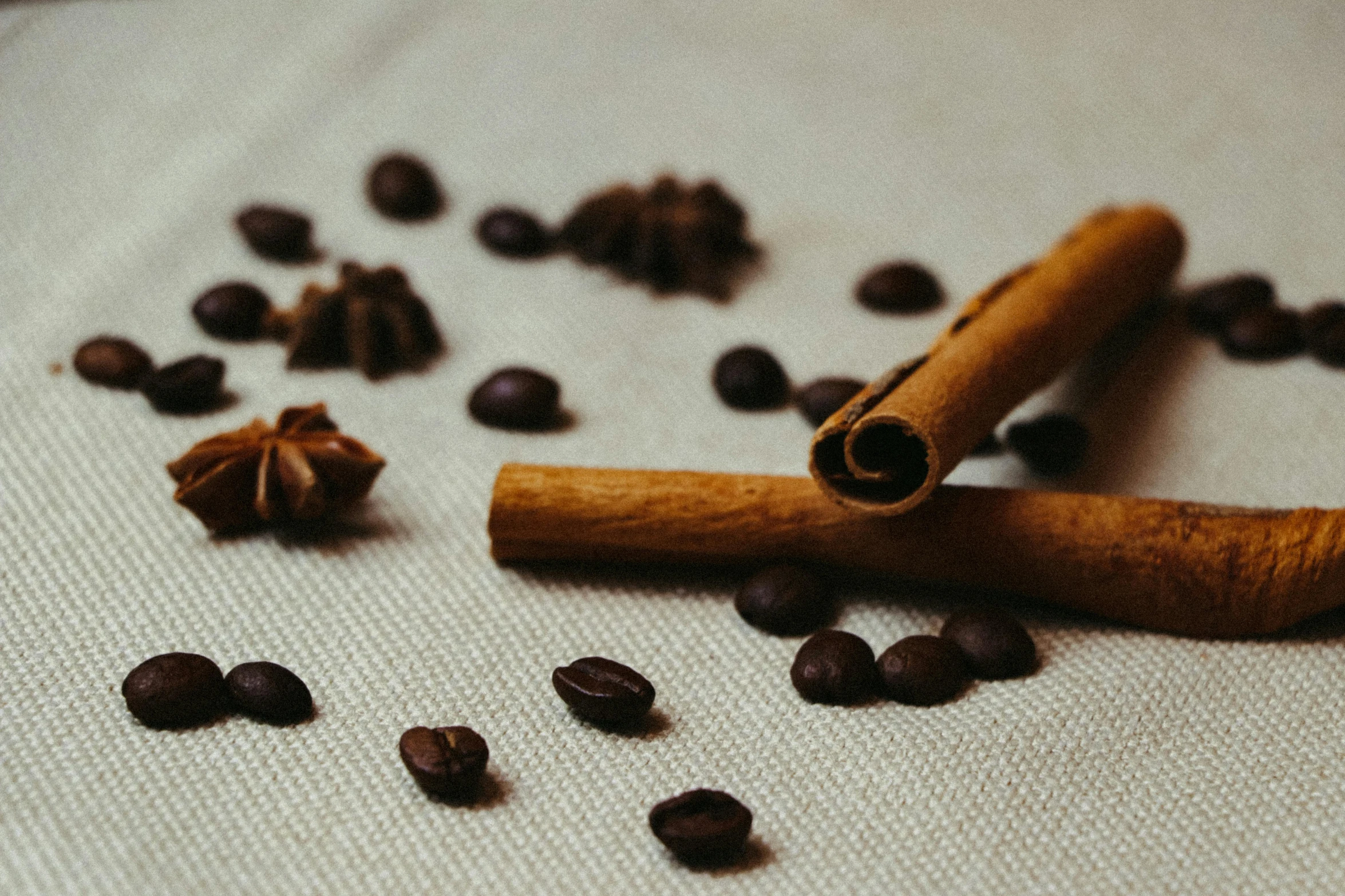 an assortment of spices sitting on top of some cloth