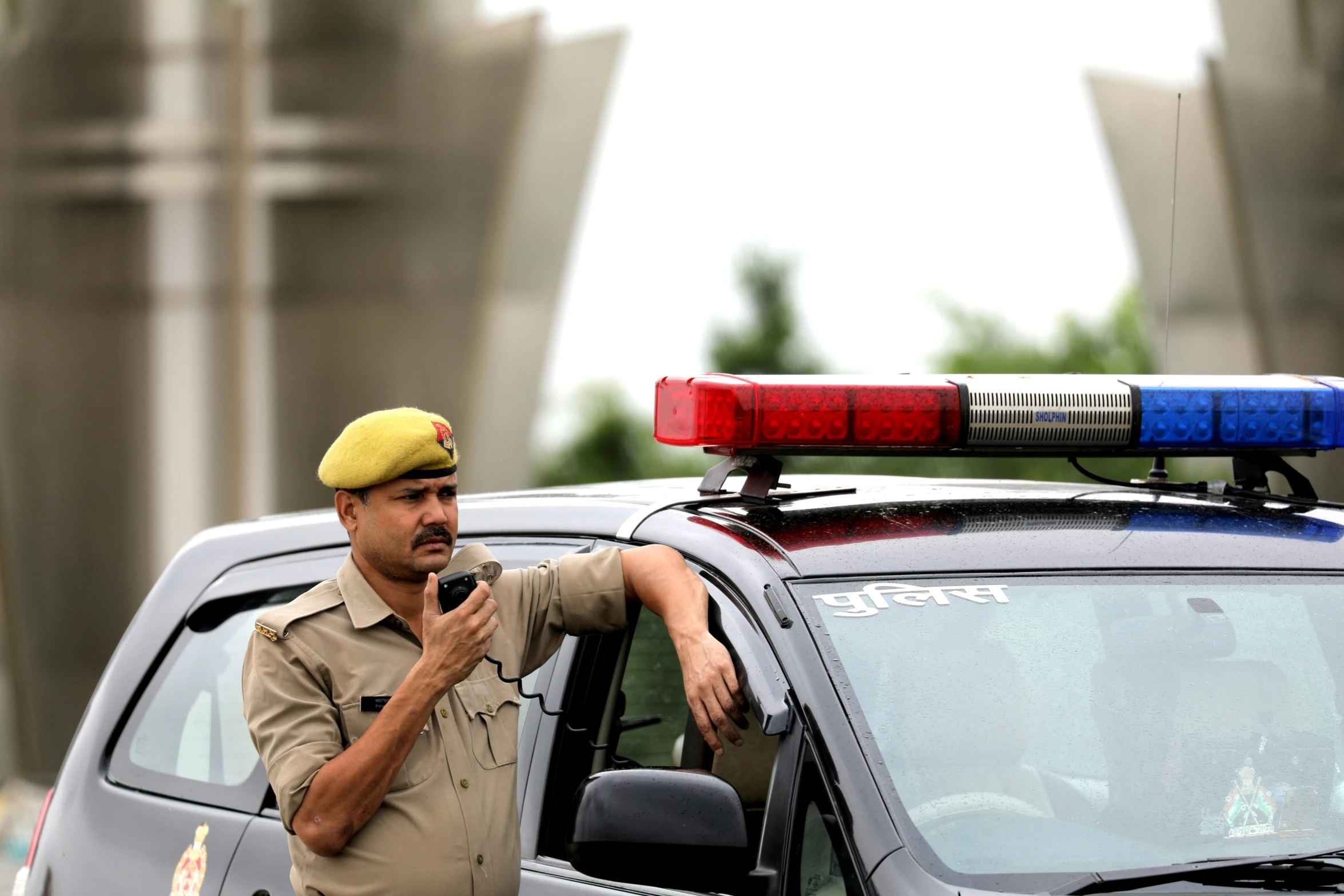 police officer with cell phone in the street