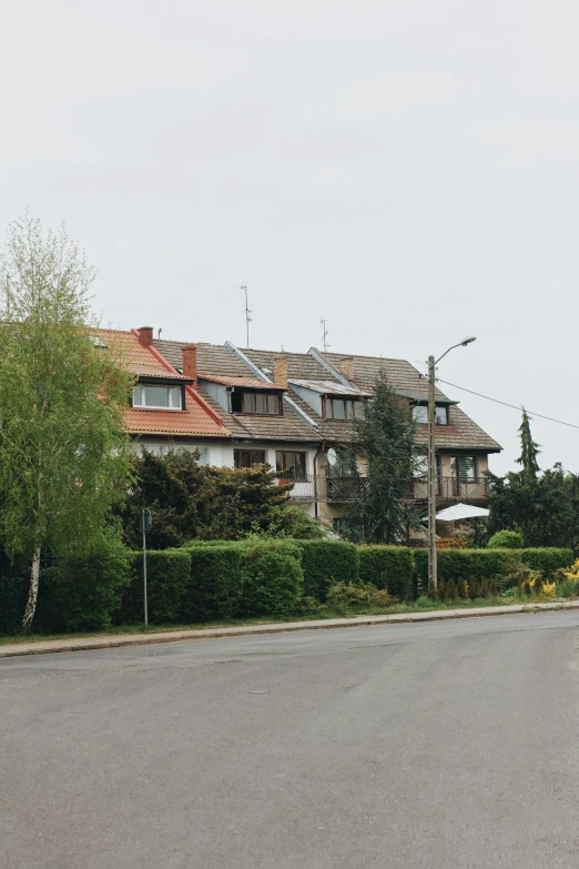 two people are walking near an apartment complex