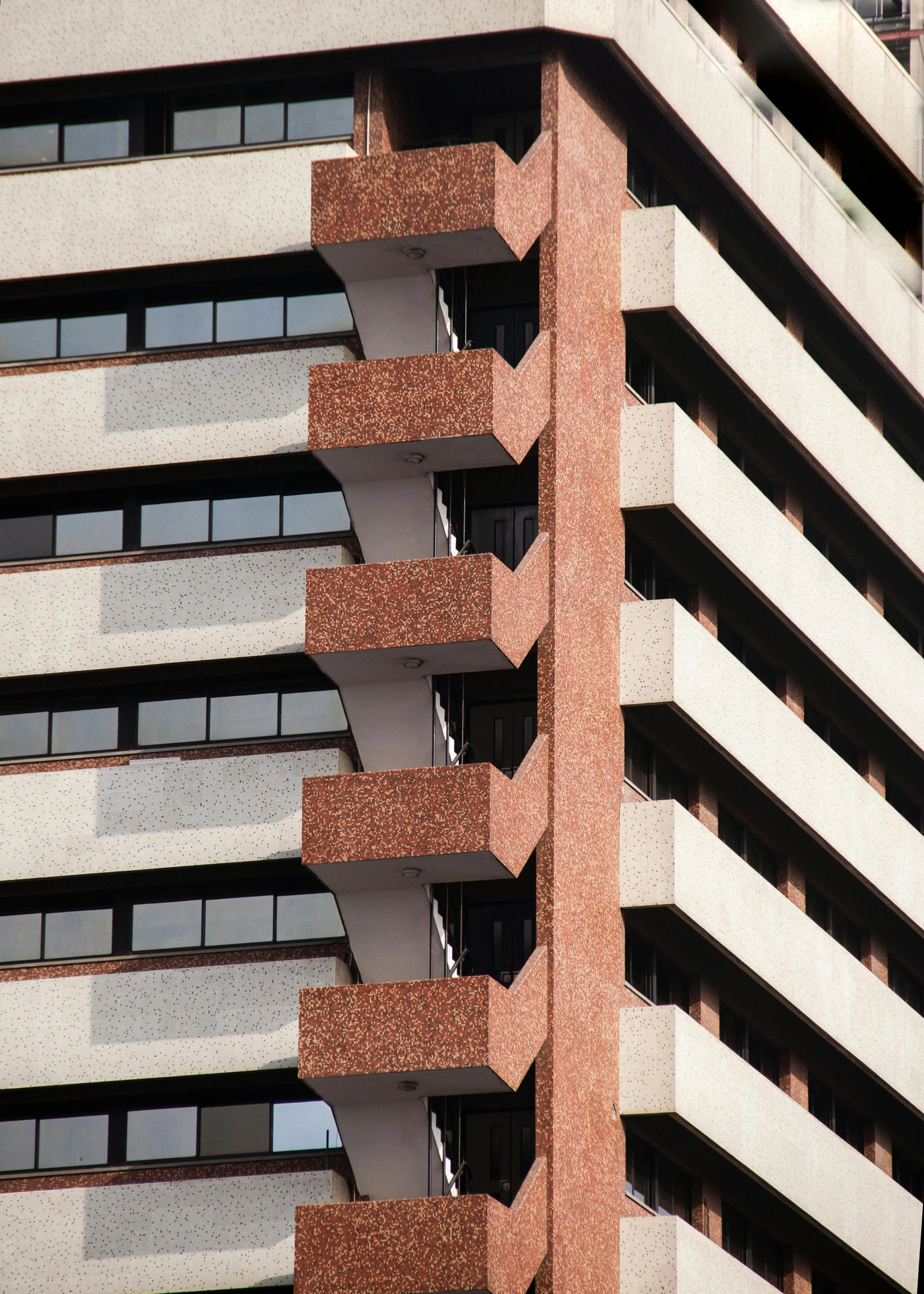 a tall building with lots of windows next to the top