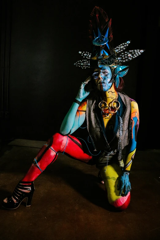 a woman in a costume with various body paint designs