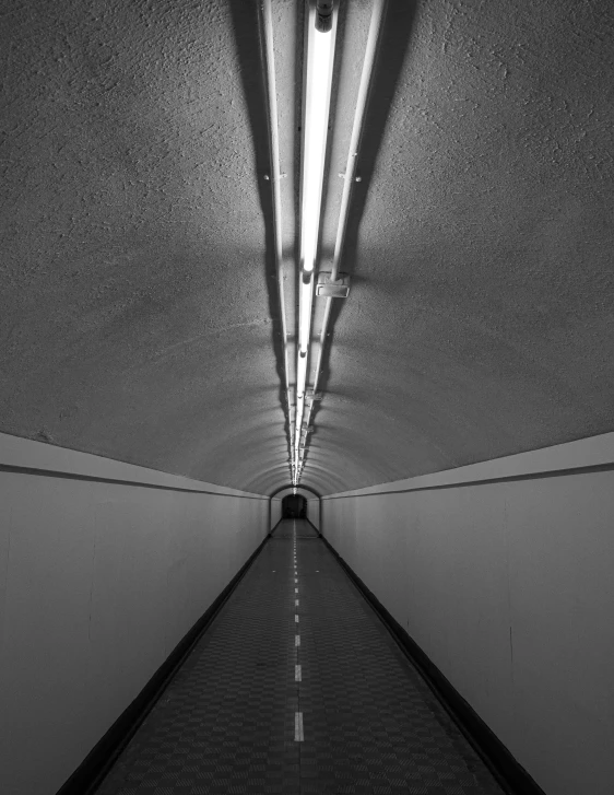 a long line of pavement in a building