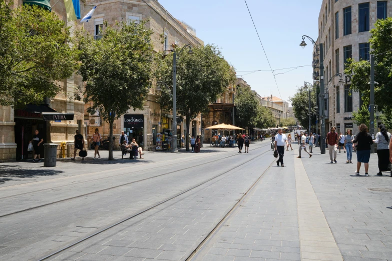 a street with people walking on it next to a building