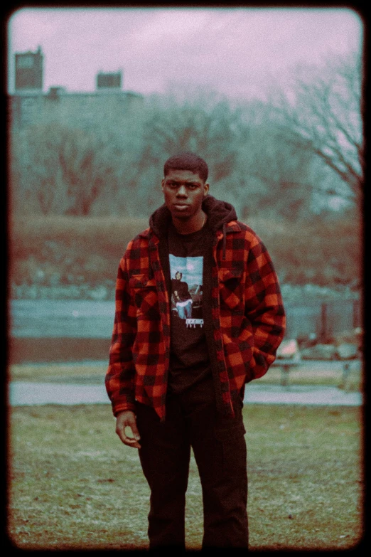 young man with red checkered jacket and skateboard