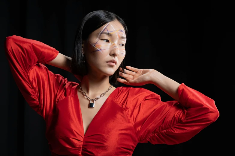 a woman with triangle stitches on her face posing for a po