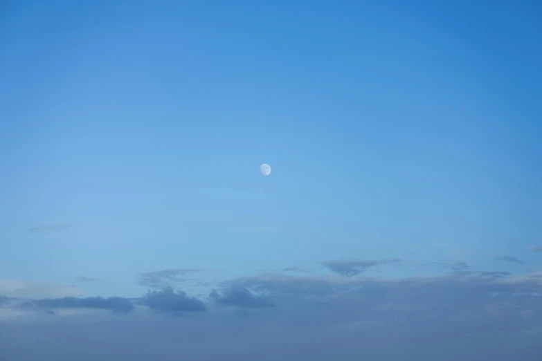 a view of the sky with clouds and a boat on it