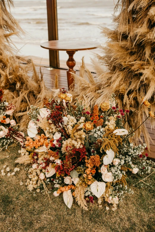 a bouquet of flowers near a beach front