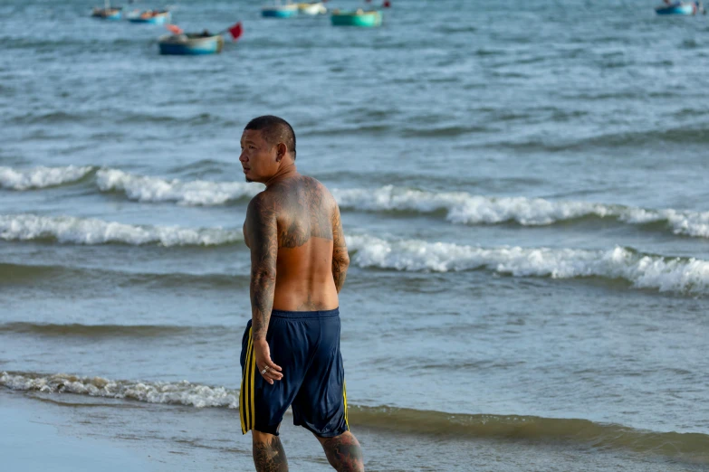 a man with  walking on the beach