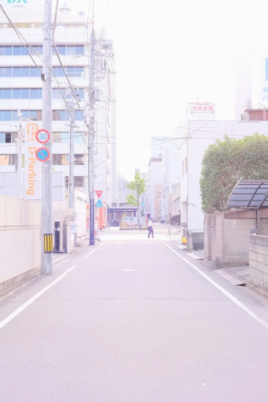 an empty city street with signs on the side