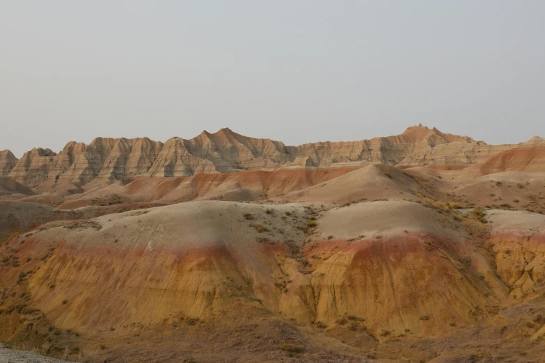 a brown valley filled with very steep hills