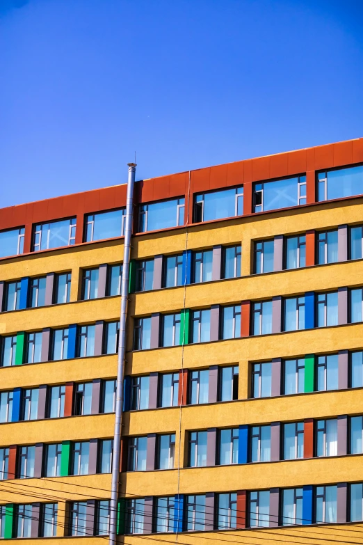 large multi - colored building with a blue sky background