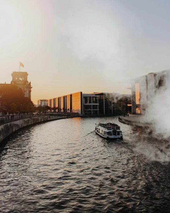 a waterway with a boat in it and steam rising out of the water