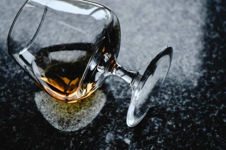 an empty wine glass on a counter top