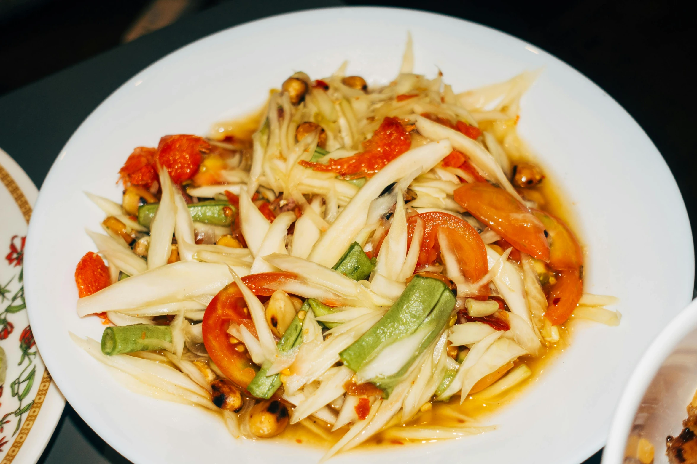 a bowl full of food that is on a table