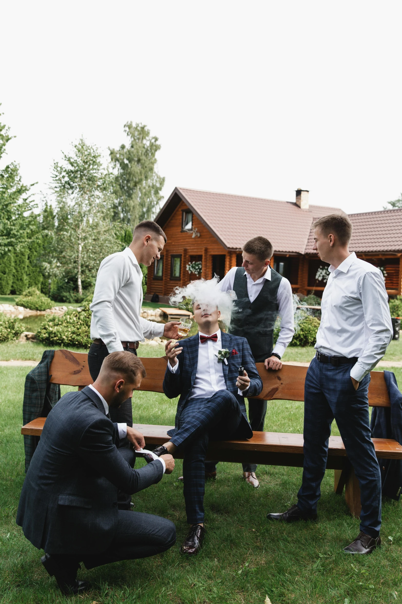 a groom and his men having fun together outside