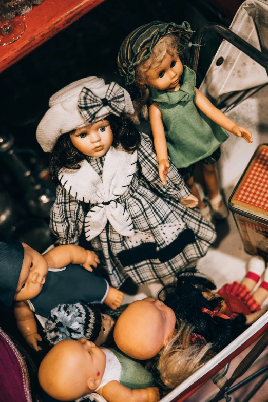 a group of dolls are inside a box