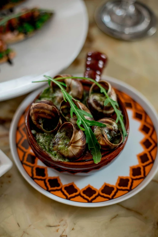 a plate topped with clams and garnishes