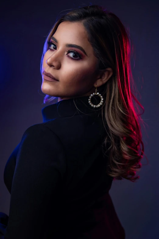 a woman in black shirt posing for the camera