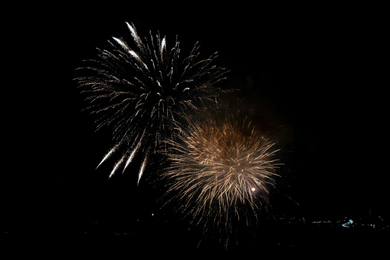 fireworks exploding over a field at night