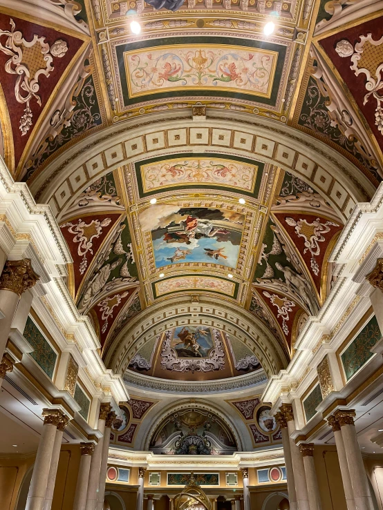 a very colorful, ornate ceiling and walls inside of a church