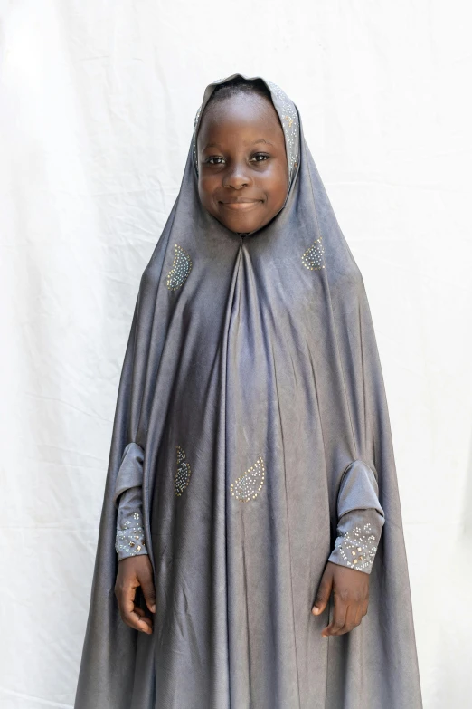 the african woman in a shawl is wearing black