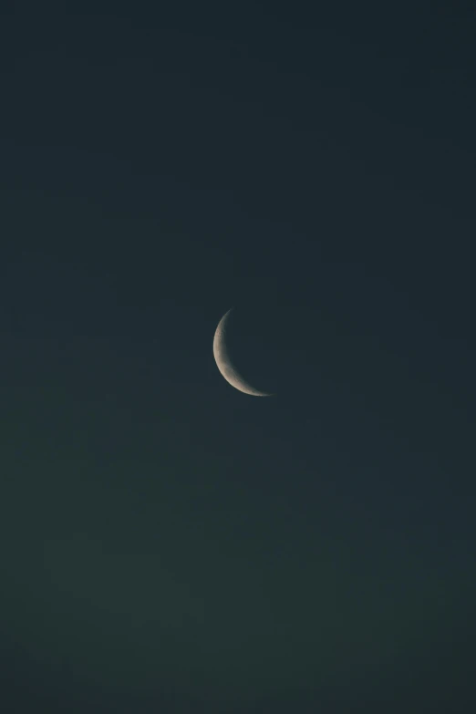 a crescent eclipse seen against a dark background