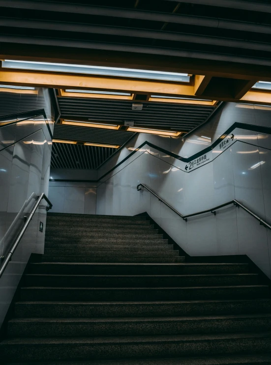 an empty hallway with the escalator facing down