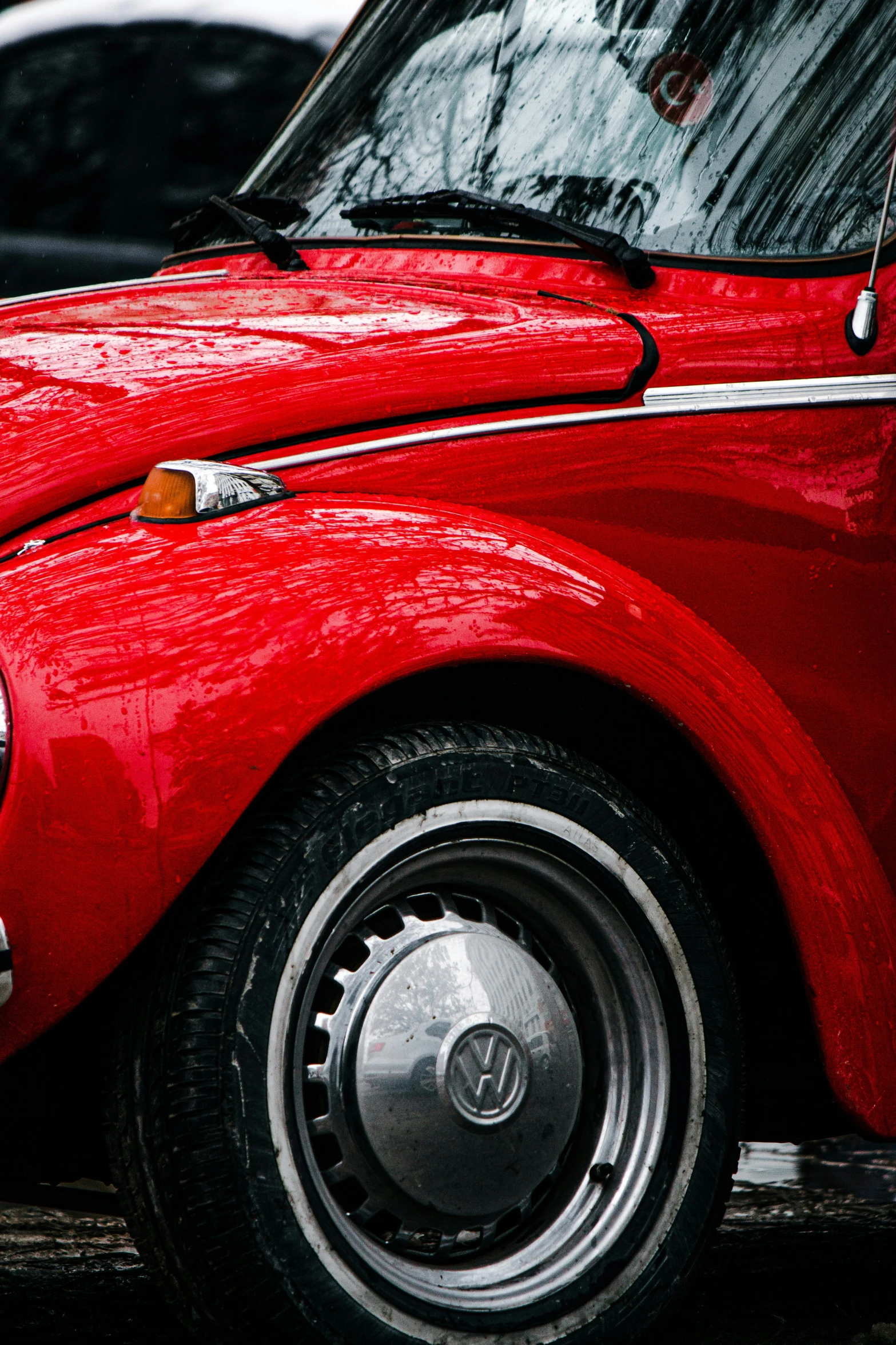 an old car is sitting in a parking lot