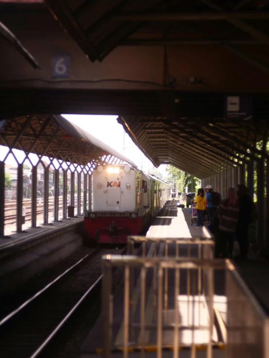 two trains are sitting in a station near each other