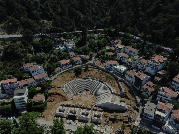 an aerial view shows the remains of a roman theater