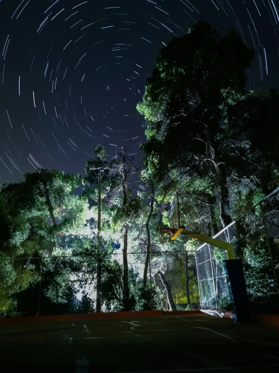 many stars in the night sky over a parking lot