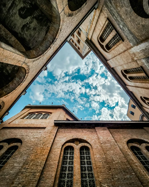 a large building with two tall windows under the blue sky