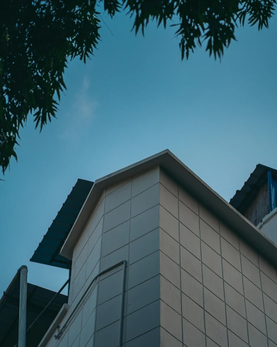 the building has a black and white sign on top of it