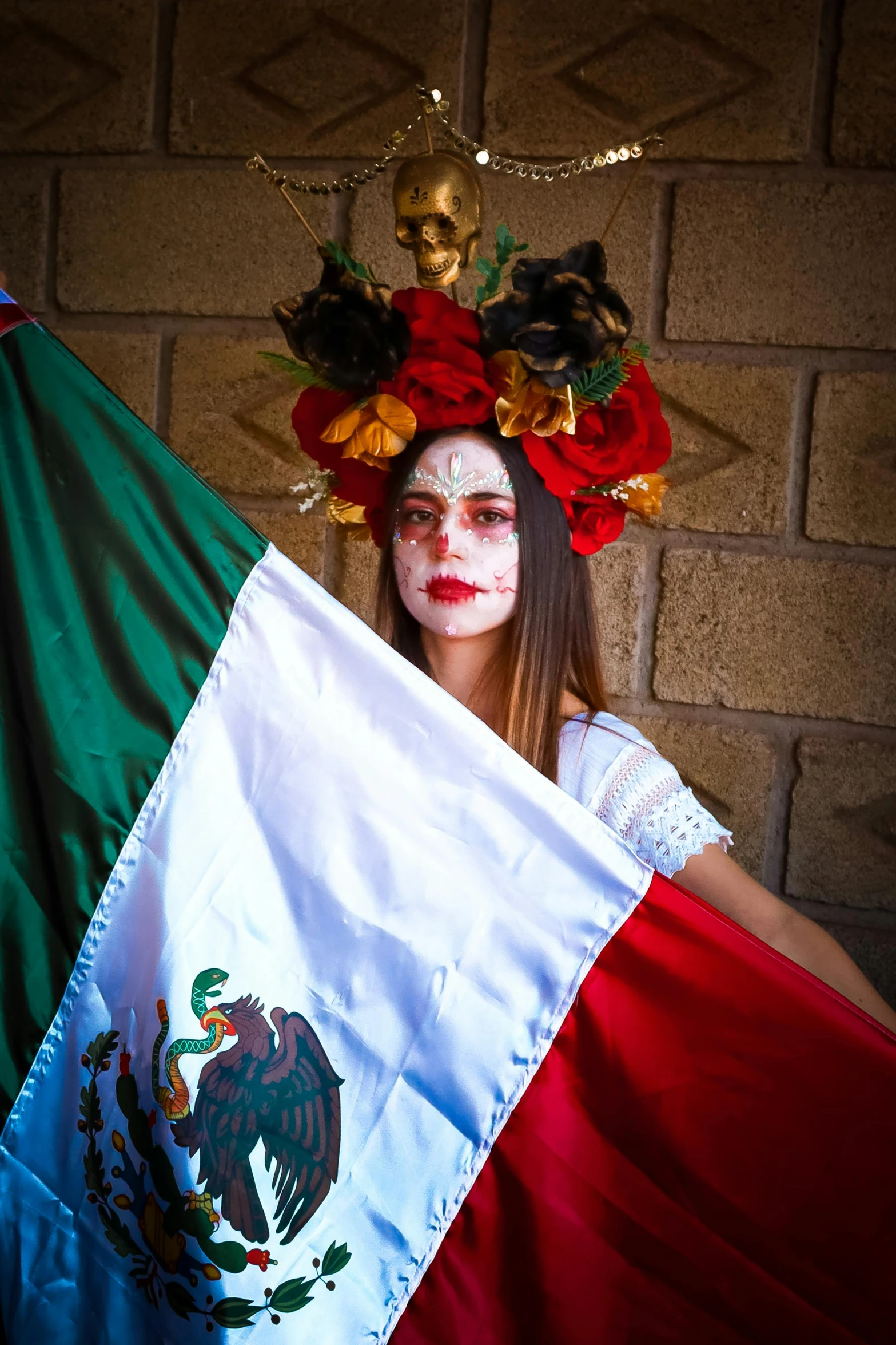 a girl dressed in mexican costume with flag