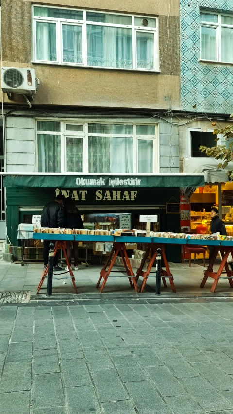 a truck with an open trailer and a table covered by cheese on the front