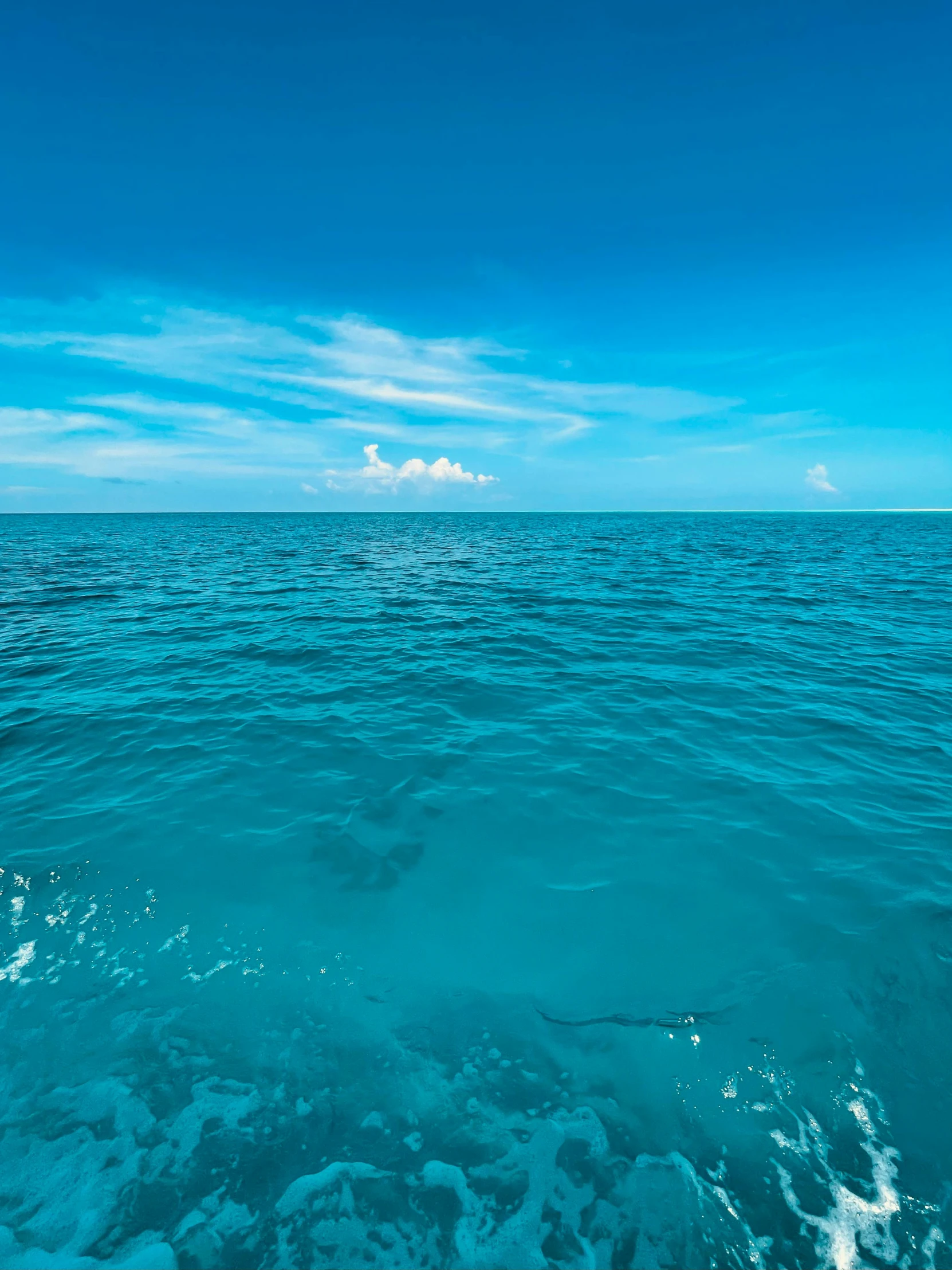 a body of water with waves in the middle