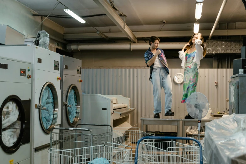 there are three ladies hanging on the clothes dryer